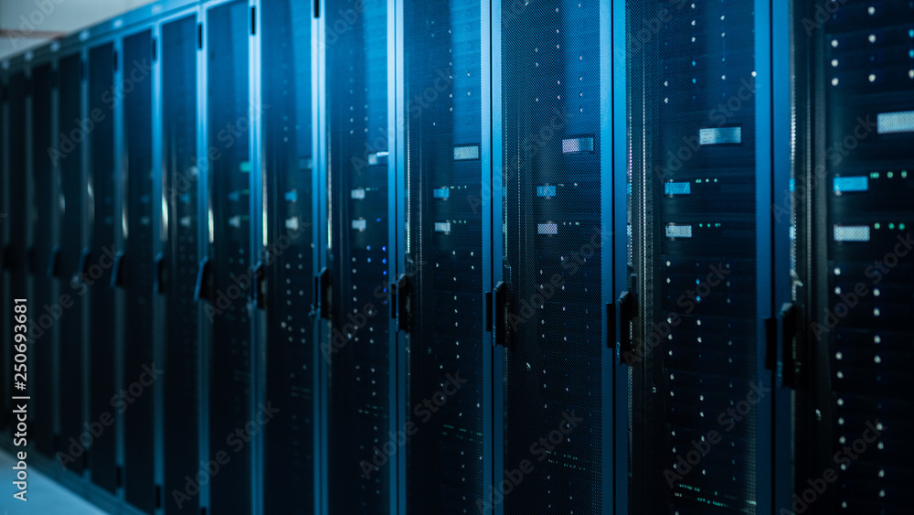 Shot of a Working Data Center With Rows of Rack Servers. Led Lights Blinking and Computers are Working. Shot of a Working Data Center With Rows of Rack Servers. Led Lights Blinking and Computers are Working.