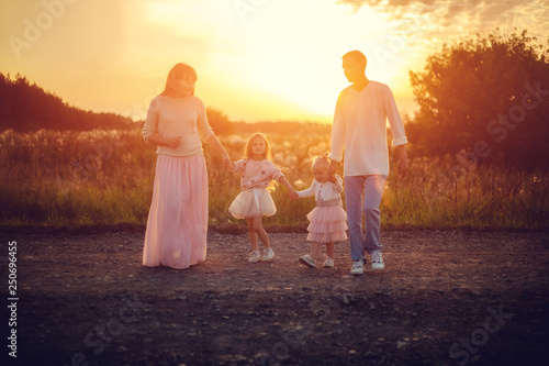 Family with children at sunset