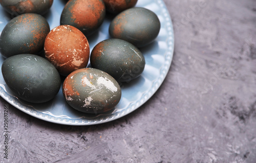 Eggs in plate on stone background.