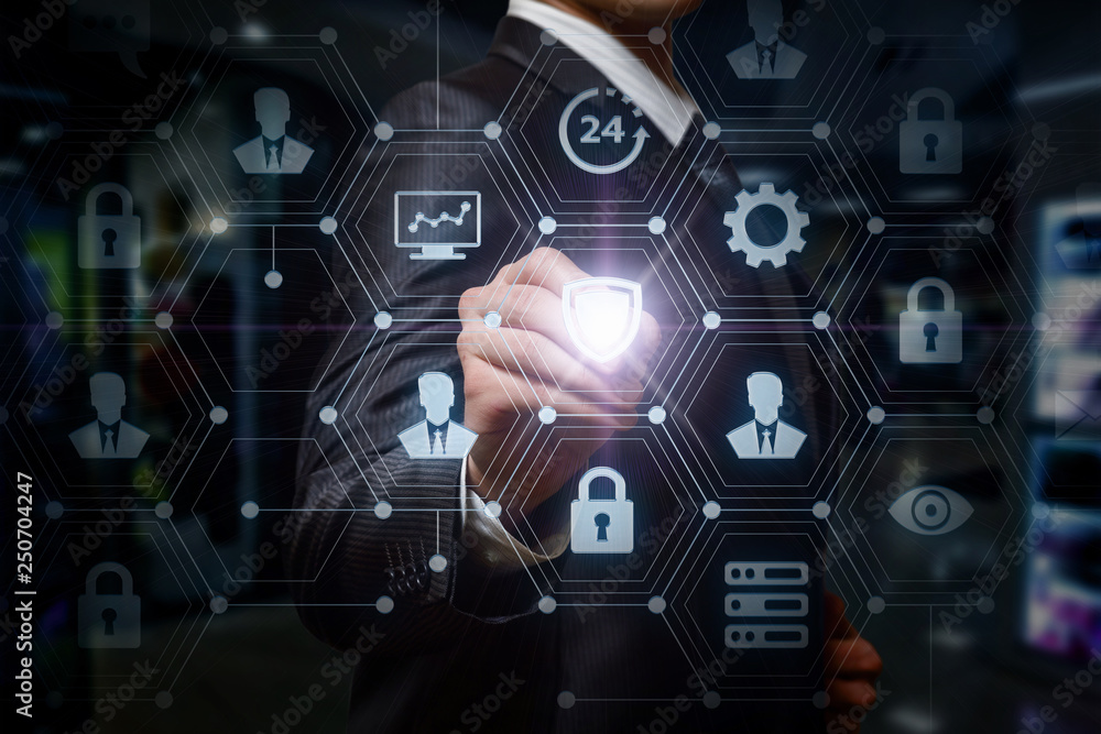 A businessman is pressing a shield inside the social digital system A businessman is pressing a shield inside the social digital system