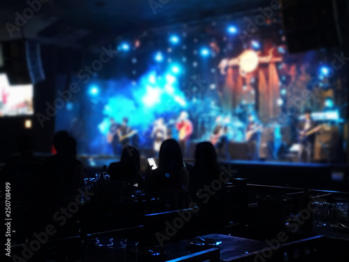 Concert and musical night club and cabaret show dark filter blurred background