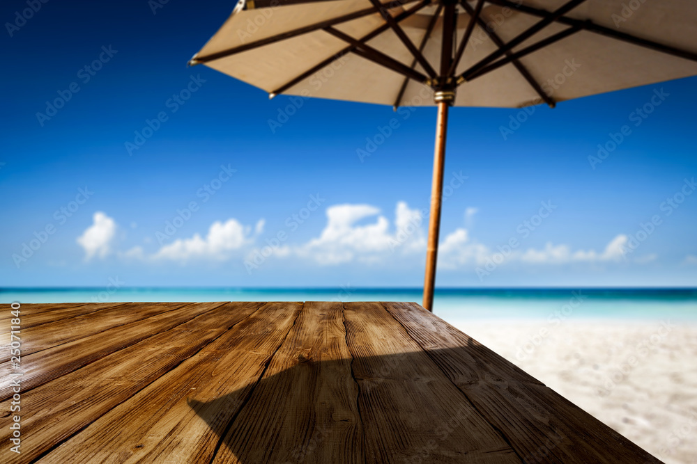 Desk of free space on beach and umbrella with shadow Desk of free space on beach and umbrella with shadow