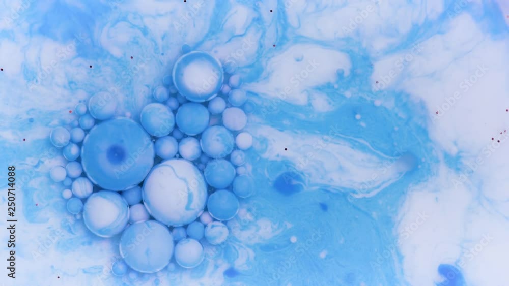 Bright colorful acrylic paint. Fantastic surface with Chaotic motion liquid. Top view. Macro structure of Multicolored Bubbles Paint and Oil. Bright colorful acrylic paint. Fantastic surface with Chaotic motion liquid. Top view. Macro structure of Multicolored Bubbles Paint and Oil.