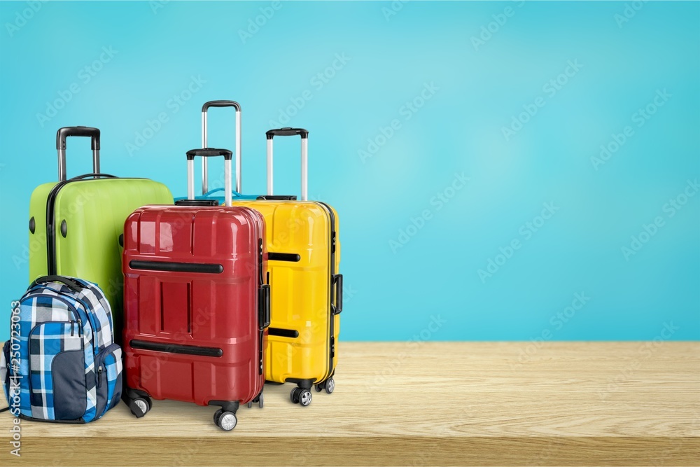 Retro suitcase with travel objects on wooden Retro suitcase with travel objects on wooden