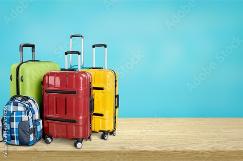 Retro suitcase with travel objects on wooden