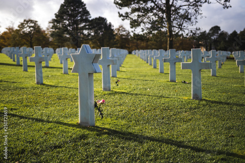 White crosses in American Cemetery for fallen soldiers during D-day Coleville near Omaha Beach, World war II, Normandy, France photo