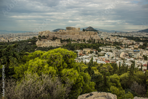 Greece Acropolis ancient temple reconstruction concept photography Athens city view in cloudy panoramic foreshortening 
