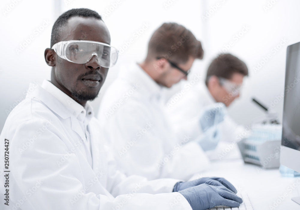 promising scientist working on a computer promising scientist working on a computer