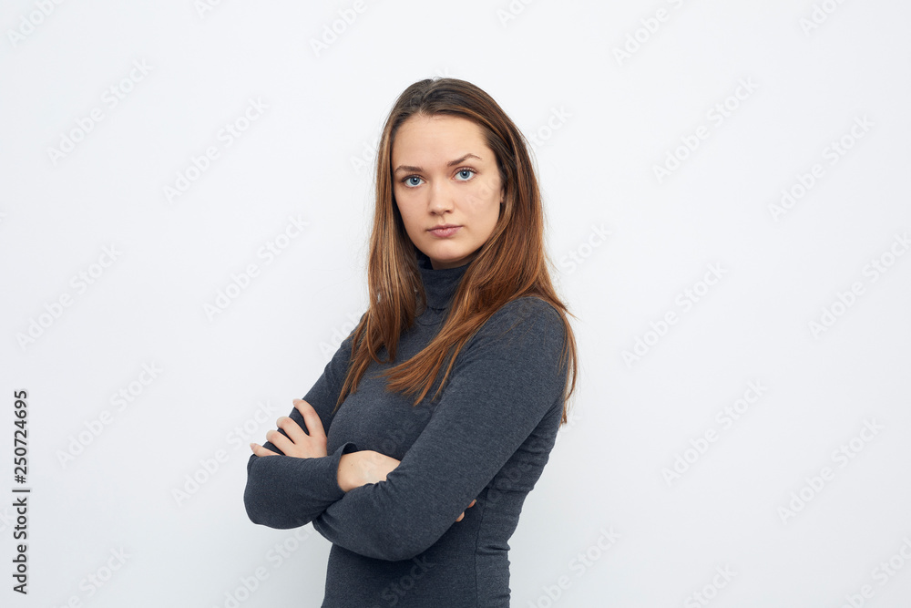 portrait of young woman looking mad in camera portrait of young woman looking mad in camera