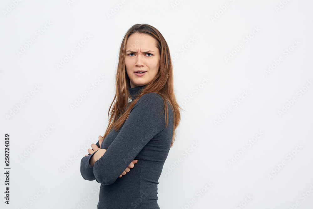 portrait of young woman looking mad in camera portrait of young woman looking mad in camera
