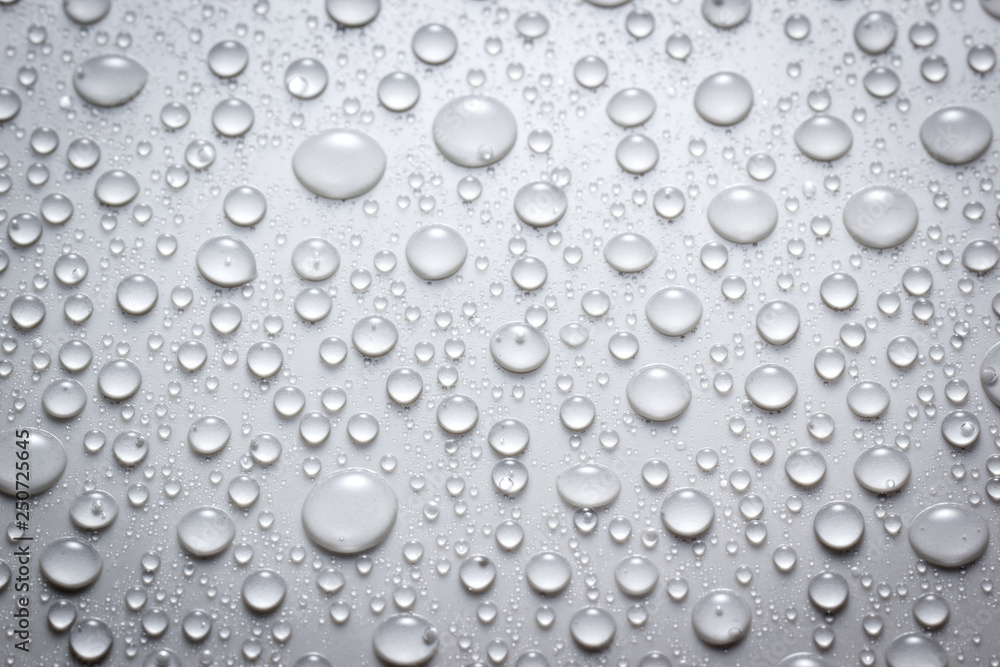 Droplets of water on white surface Droplets of water on white surface