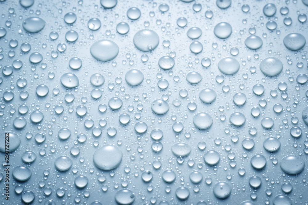 Droplets of water on blue surface Droplets of water on blue surface