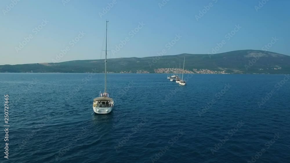 Aerial. Eight yachts lined up on Adriatic sea in Montenegro Aerial. Eight yachts lined up on Adriatic sea in Montenegro