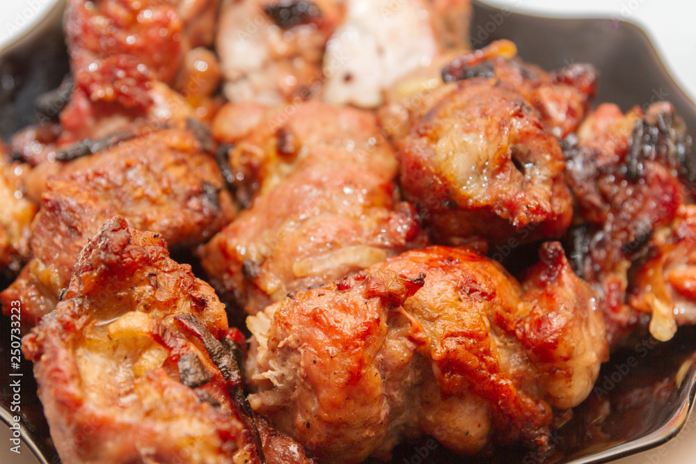 Delicious appetizing shish kebab of pork meat is in the plate