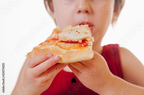 Little cute child girl eating pizza at home.  Happy childhood  food  rest and joy concept.