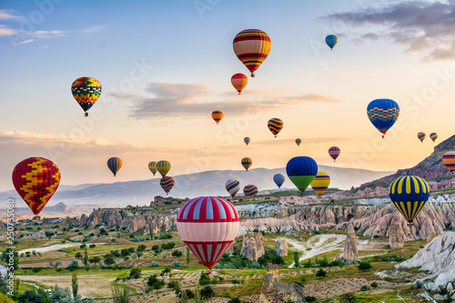 The great tourist attraction of Cappadocia - balloon flight. Cappadocia is known around the world as one of the best places to fly with hot air balloons. Goreme, Cappadocia, Turkey photo