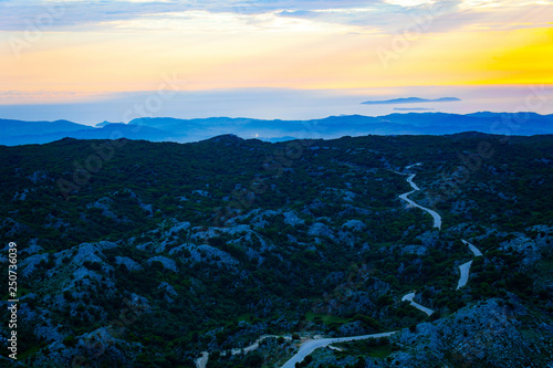 erial view of mountain with road. Twilight above the hills with roads on the top