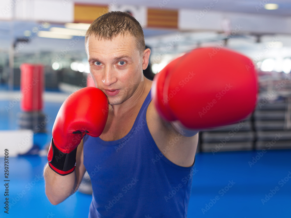 Adult male who is training in  professional box gym