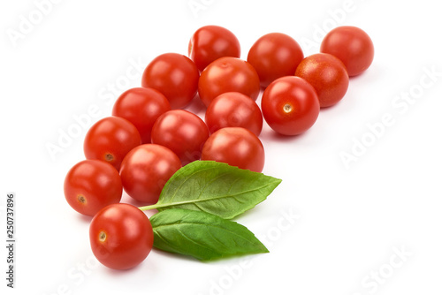 Fresh cherry tomatoes with basil, close-up, isolated on white background