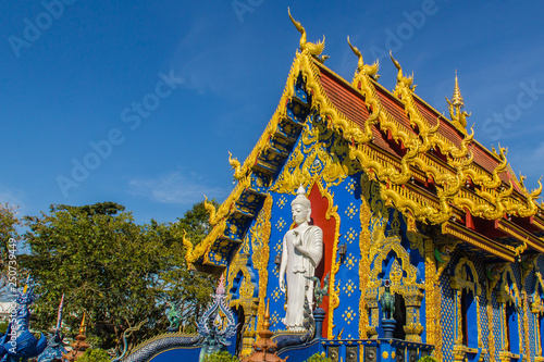 Beautiful public Buddhist church at Wat Rong Sua Ten in Chiang Rai, Thailand. Wat Rong Suea Ten (Temple of Tigers Leaping over Channel) or the Blue Temple is above all its magnificent blue interior. photo