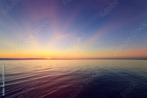 early morning sunrise on a choppy river / wind early spring landscape