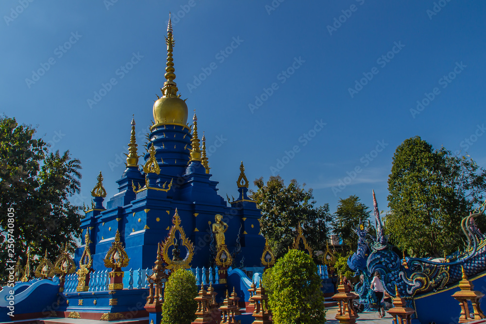 Fototapeta premium Beautiful blue pagoda at Wat Rong Suea Ten Temple, also known as the Blue Temple. Wat Rong Suea Ten or the Tiger Temple is locate at Chiang Rai province, northern part of Thailand.