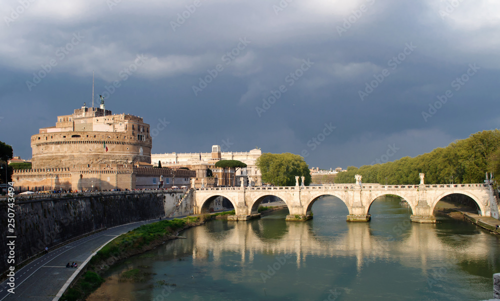Sant` Angelo Castle and Tiber River in Rome, Italy . The Mausoleum of Hadrian, usually known as Castel Sant Angelo is a towering cylindrical building in Parco Adriano, Rome, Italy. Sant` Angelo Castle and Tiber River in Rome, Italy . The Mausoleum of Hadrian, usually known as Castel Sant Angelo is a towering cylindrical building in Parco Adriano, Rome, Italy.