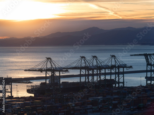 port cranes cargo ship and container above view at sunset