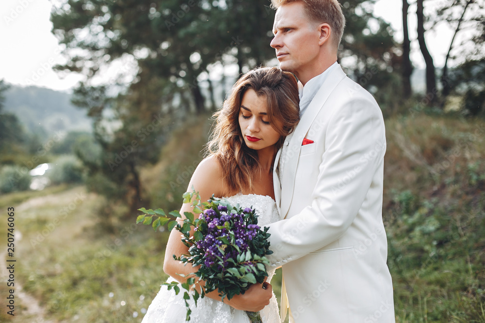 Beautiful wedding couple in a summer field Beautiful wedding couple in a summer field