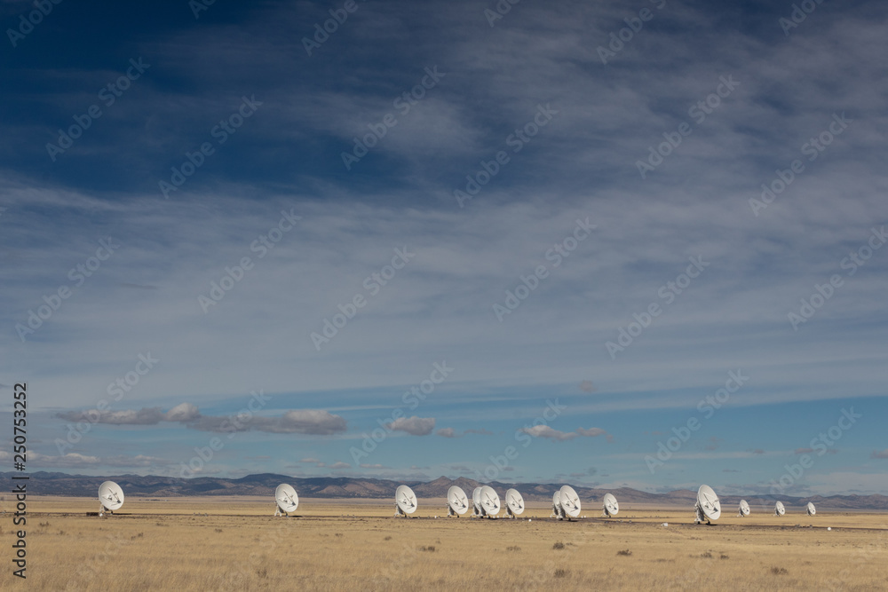 Very Large Array New Mexico desert, arrangement of radio astronomy observatory dishes, copy space, horizontal aspect Very Large Array New Mexico desert, arrangement of radio astronomy observatory dishes, copy space, horizontal aspect