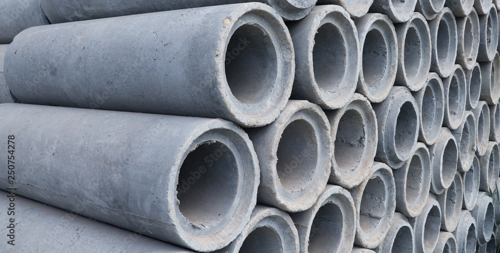 Precast reinforced concrete pipes laying on the ground Precast reinforced concrete pipes laying on the ground