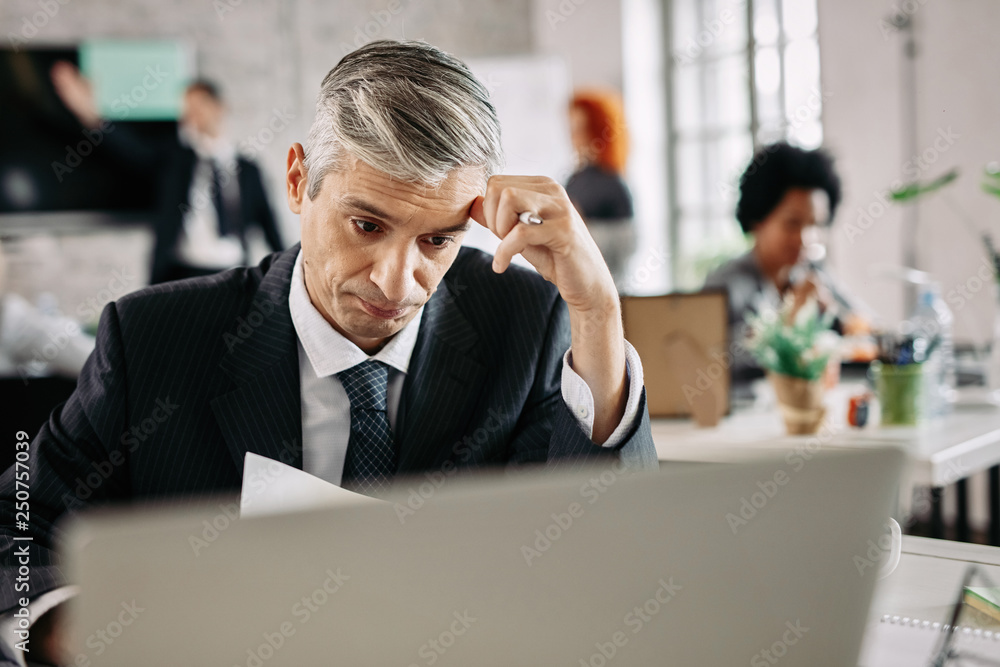 Worried businessman having some problems at work. Worried businessman having some problems at work.