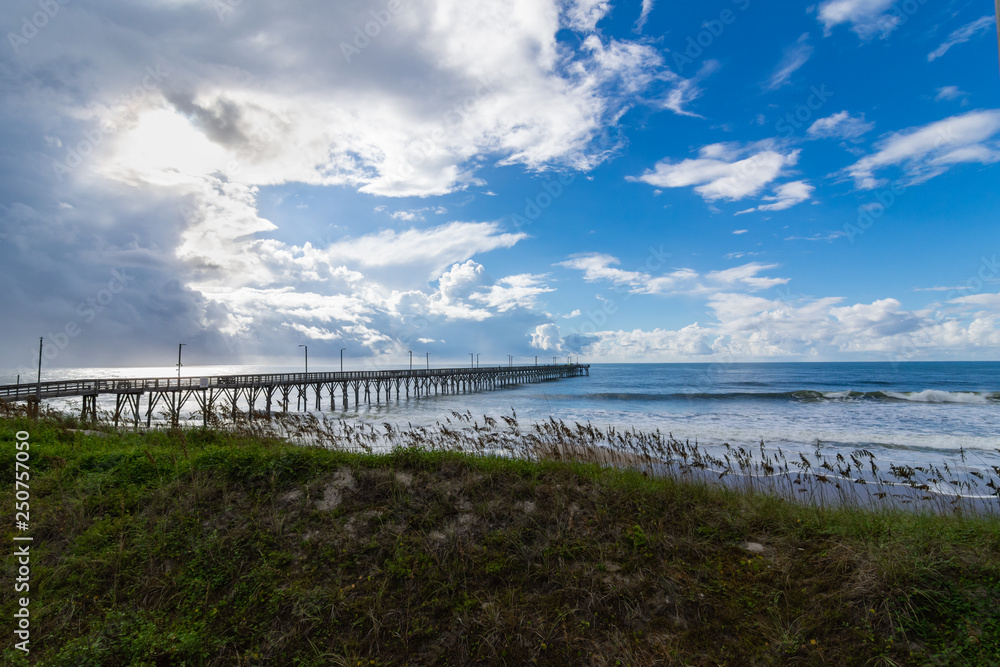 Pier over the ocean with sea grasses