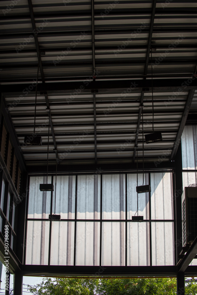 Aluminum Metal corrugated roof sheets and black steel column structure. Aluminum Metal corrugated roof sheets and black steel column structure.