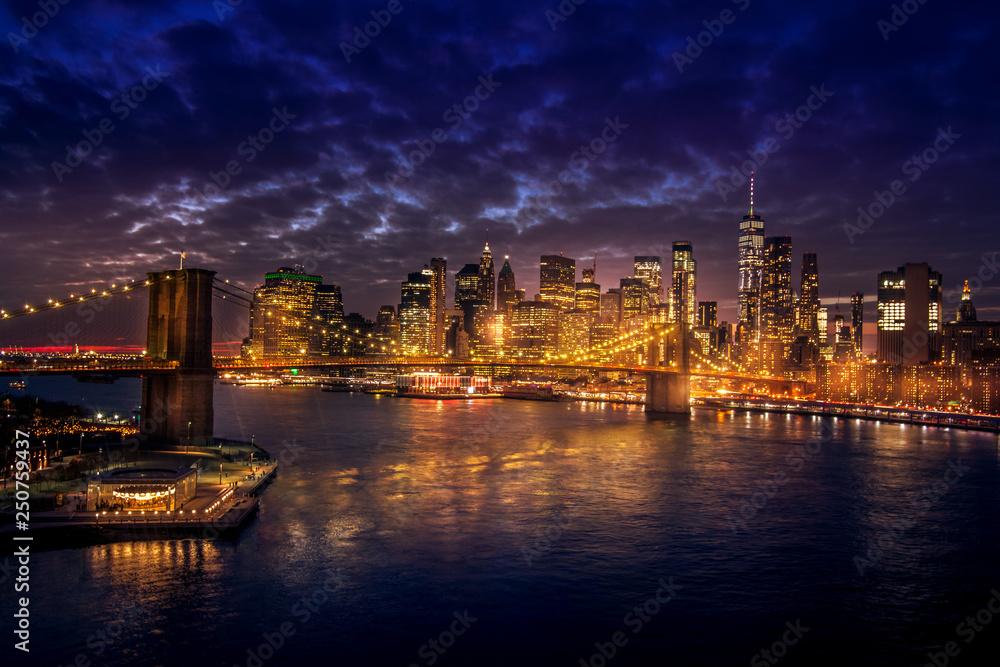 Must see when visiting New York City. View of Lower Manhattan and  Brooklyn at sunset. Night scene. Light trails. City lights. Urban living, travel, real estate  and transportation concept