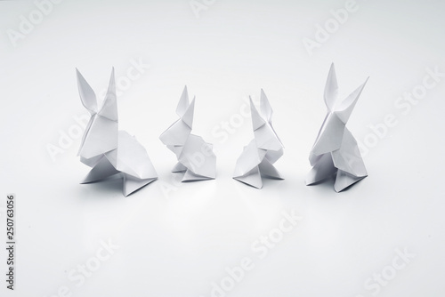Fototapeta Naklejka Na Ścianę i Meble -  White origami rabbits on a white background.