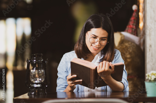 woman reading book with happy.