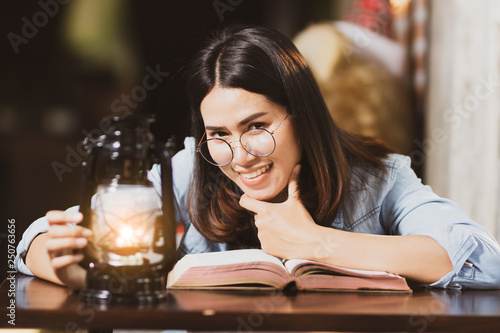 woman reading book with happy.