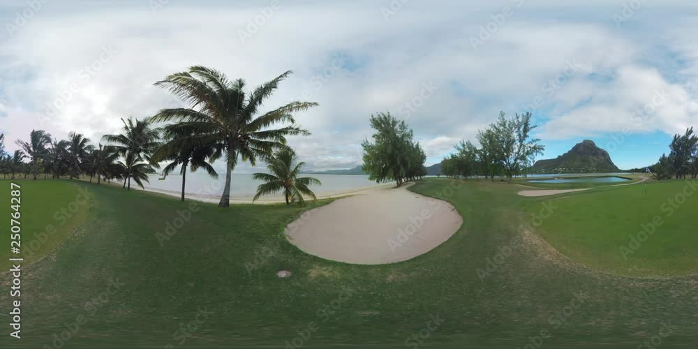 360 VR video. Green empty golf course on the ocean coast surrounded with green trees. Landscape with Le Morne Brabant, Mauritius 360 VR video. Green empty golf course on the ocean coast surrounded with green trees. Landscape with Le Morne Brabant, Mauritius