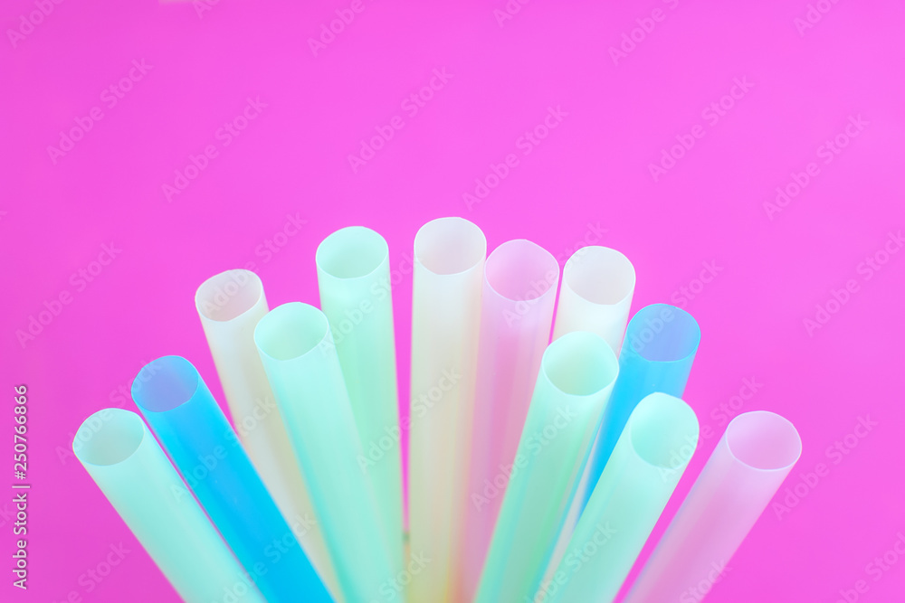 Tubules for a cocktail on a pink background