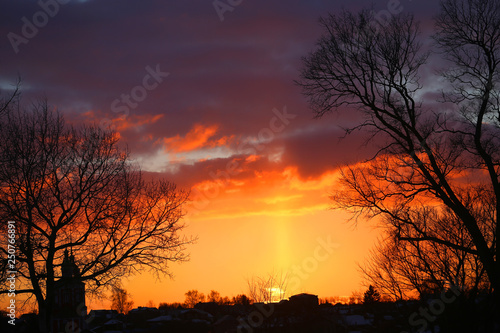 Vivid pictures of the sunset in the winter with the Church in Russia