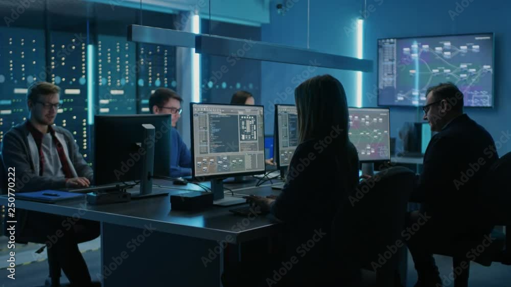 Team of Young IT Programers Working on Desktop Computers in Data Center ...