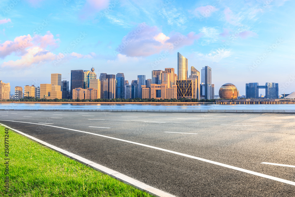 Empty asphalt road and modern city skyline with buildings in Hangzhou Empty asphalt road and modern city skyline with buildings in Hangzhou