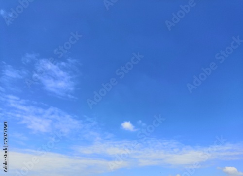 Blue sky with white, soft clouds.The sky is clear. 