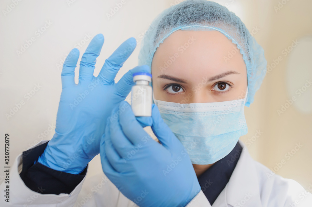 Female Doctor holding a vial of white drug powder antibiotics/ penicillin in hospital laboratory room.