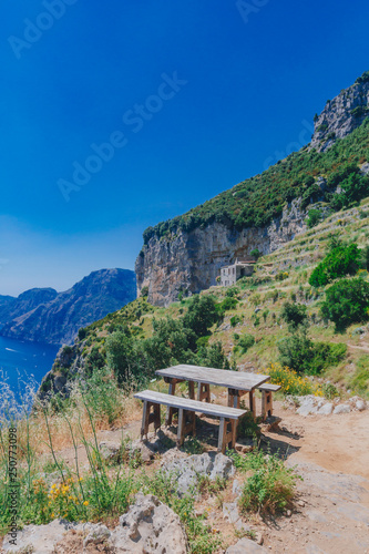 Table and benches along Path of the Gods, a hiking trail along Amalfi Coast, near Positano, Italy