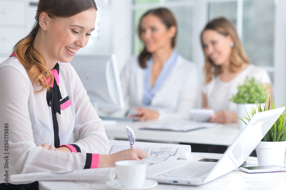 Portrait of young women working in modern office Portrait of young women working in modern office