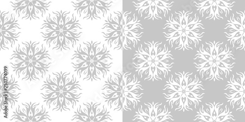 Compilation of gray and white floral patterns. Set of seamless backgrounds