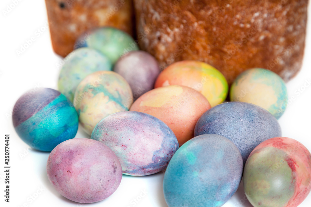 Two Easter cakes and colorful eggs on white background Two Easter cakes and colorful eggs on white background