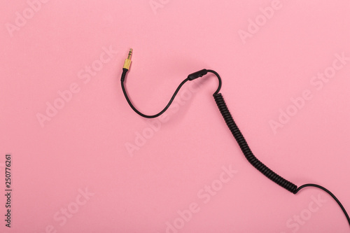 black wire isolated on a pink background abstraction